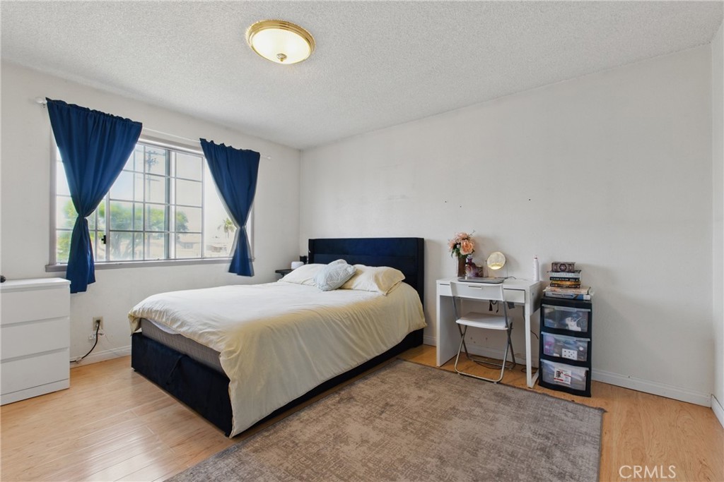 302 East 213th Street Carson, CA 90745 - Photo 29 of 40 a bedroom with a bed and a window