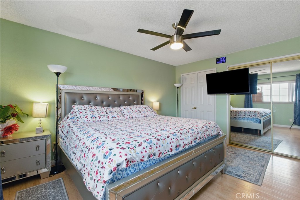 302 East 213th Street Carson, CA 90745 - Photo 32 of 40 a bedroom with a bed and a flat screen tv