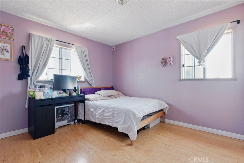 302 East 213th Street Carson, CA 90745 - Photo 33 of 40 a bedroom with a bed and a window