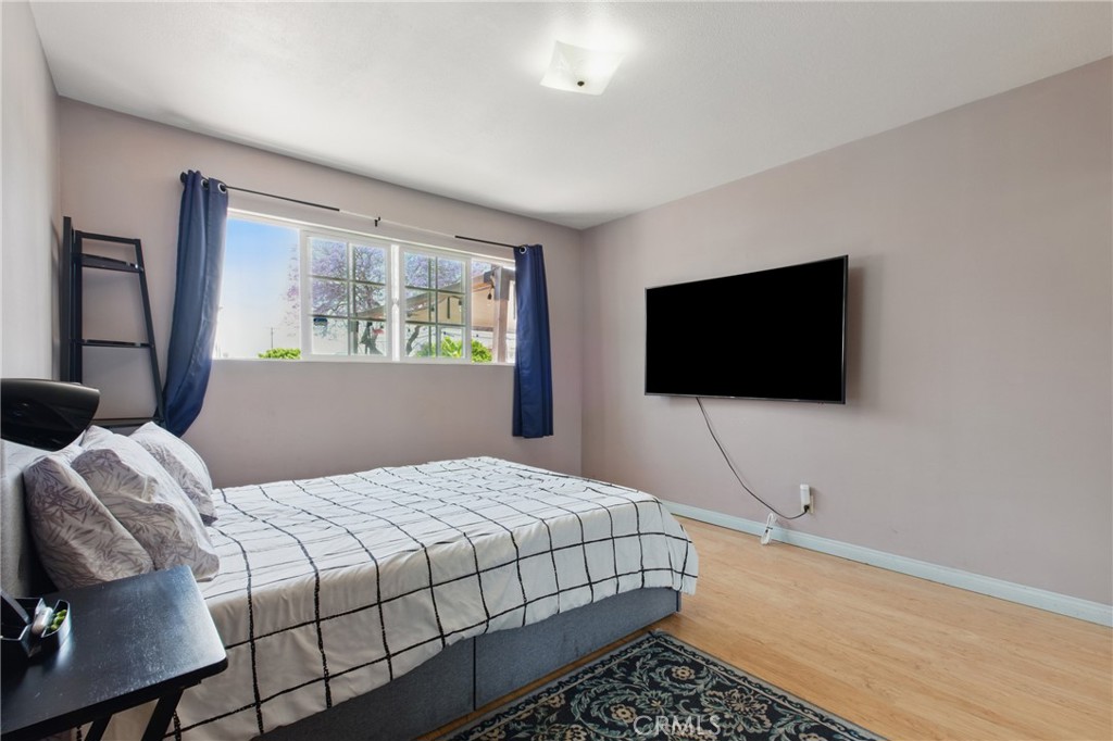 302 East 213th Street Carson, CA 90745 - Photo 37 of 40 a bedroom with a bed and a flat screen tv