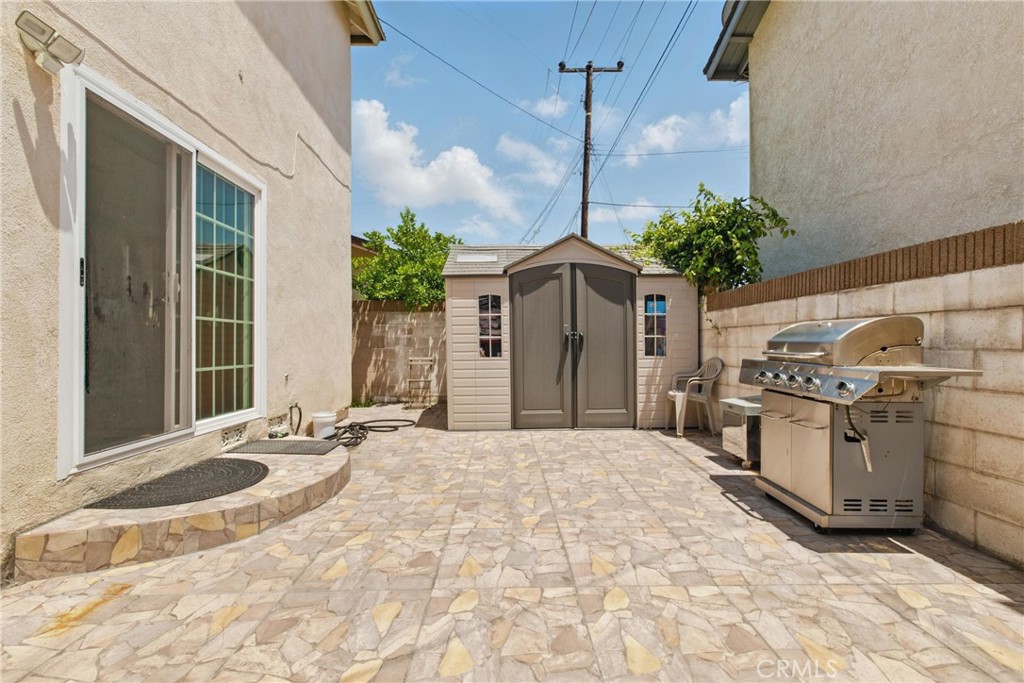 302 East 213th Street Carson, CA 90745 - Photo 38 of 40 a view of a house with a tub and potted plants