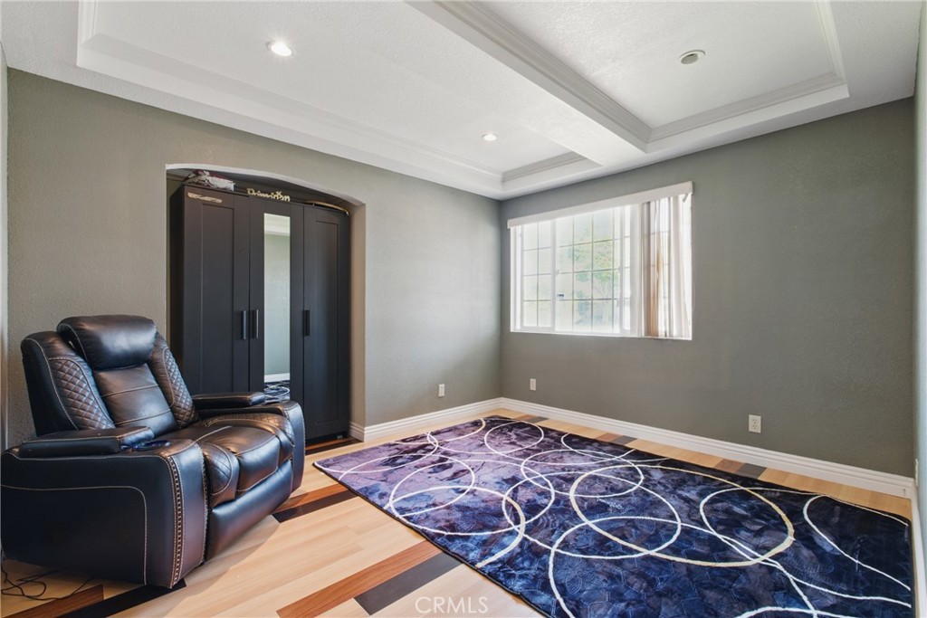 302 East 213th Street Carson, CA 90745 - Photo 10 of 40 a bedroom with a bed and wooden floor