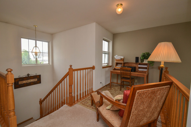 269 Grand Ridge Road, Unit 269 St. Charles, IL 60175 - Photo 11 of 25 a living room with furniture and a window