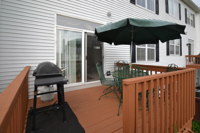 269 Grand Ridge Road, Unit 269 St. Charles, IL 60175 - Photo 20 of 25 a table and chairs in the patio