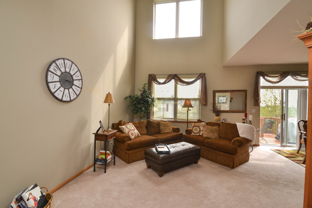 269 Grand Ridge Road, Unit 269 St. Charles, IL 60175 - Photo 2 of 25 a living room with furniture and a large window