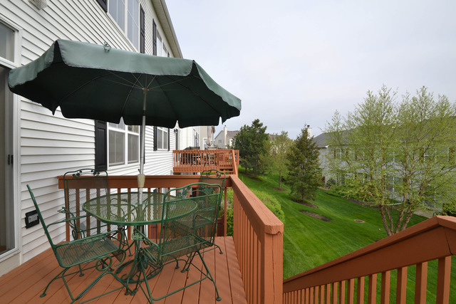 269 Grand Ridge Road, Unit 269 St. Charles, IL 60175 - Photo 21 of 25 a table and chairs in patio of the house
