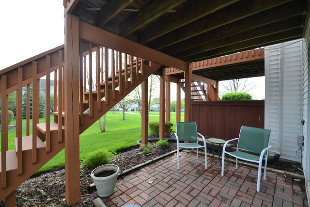 269 Grand Ridge Road, Unit 269 St. Charles, IL 60175 - Photo 22 of 25 a couple of chairs in front of a glass door
