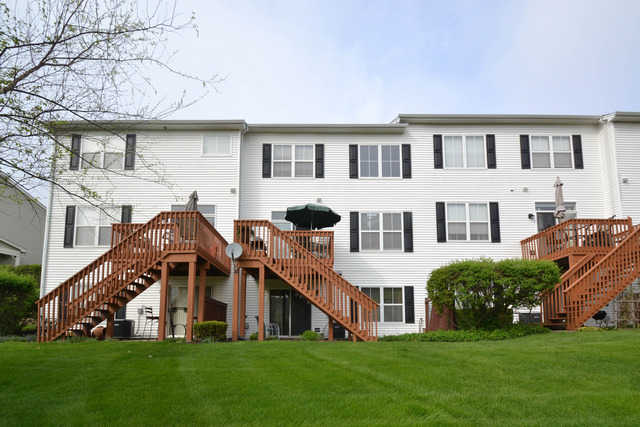 269 Grand Ridge Road, Unit 269 St. Charles, IL 60175 - Photo 25 of 25 a view of a house with a yard