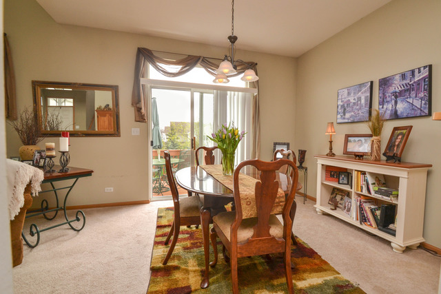 269 Grand Ridge Road, Unit 269 St. Charles, IL 60175 - Photo 5 of 25 a view of a dining room with furniture window and outside view