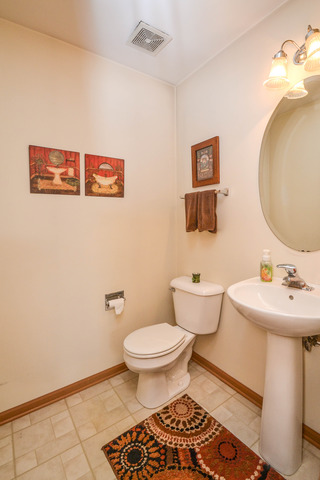 269 Grand Ridge Road, Unit 269 St. Charles, IL 60175 - Photo 9 of 25 a bathroom with a sink toilet and a mirror