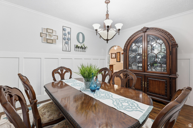 2342 Charros Road Sandy, UT 84092 - Photo 13 of 94 Dining area featuring white wainscoting and crown molding