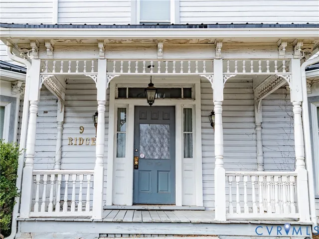 a bathroom with a sink a toilet and a window