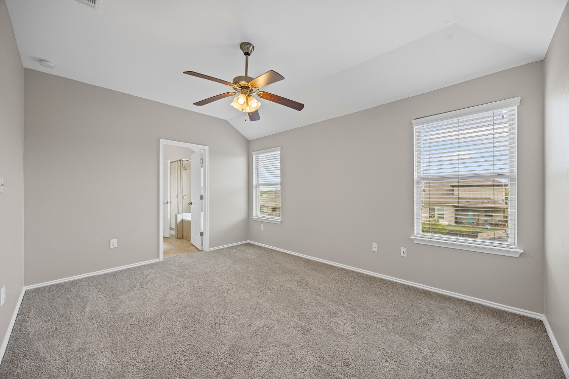 139 Diamondback Cove Buda, TX 78610 - Photo 7 of 15 a view of an empty room with a window