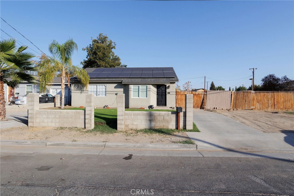 1724 Terrace Bakersfield, CA 93304 - Photo 2 of 9 a view of a house with a yard and potted plants