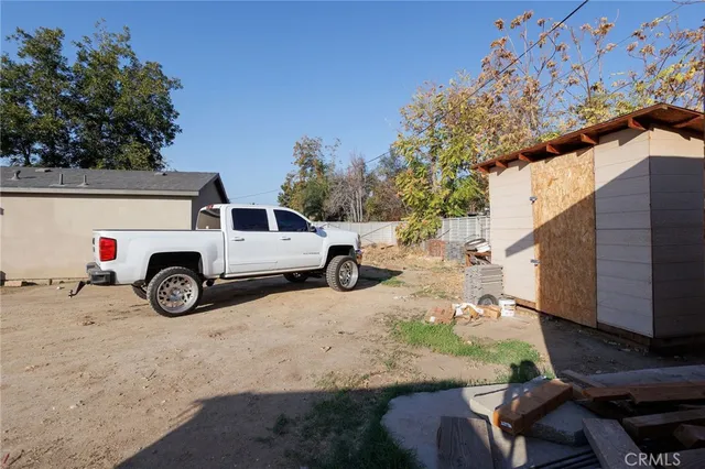 a view of a car parked in front of a house