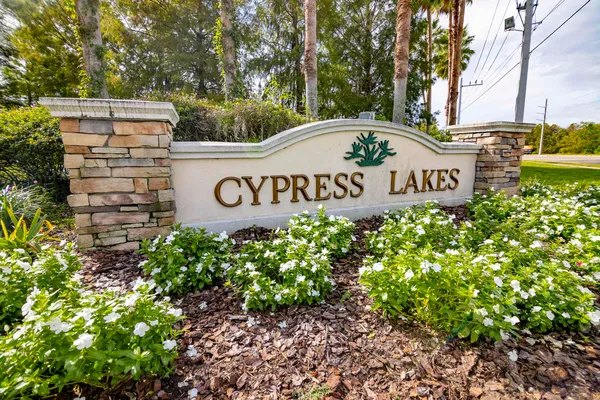 an aerial view of a house with garden space and a fountain
