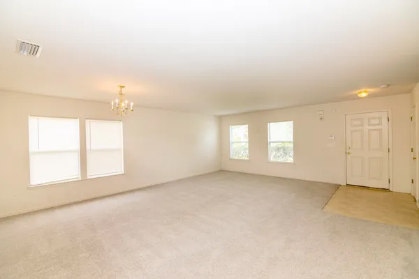 a view of a kitchen with a sink and cabinets