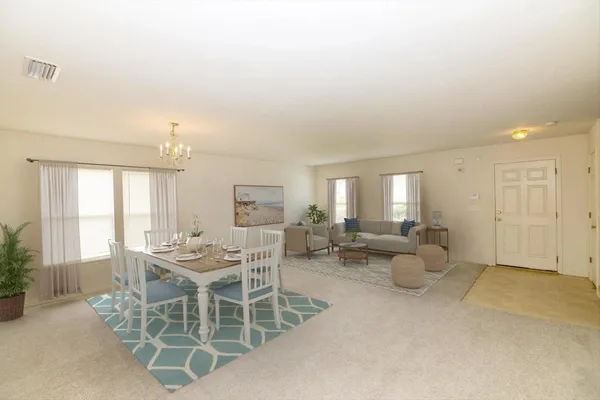 a kitchen with white cabinets sink and appliances