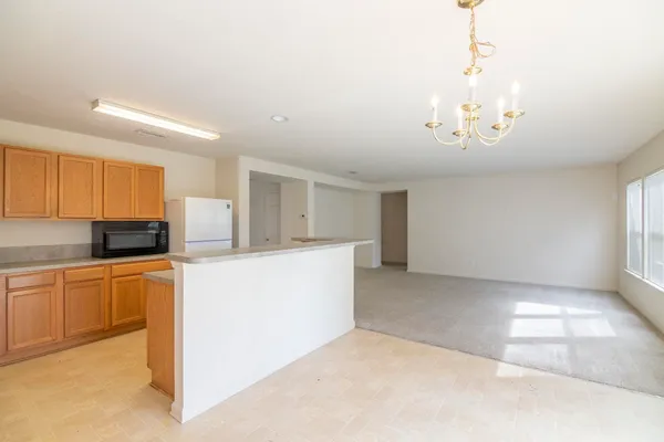 a view of a kitchen with a sink and a kitchen
