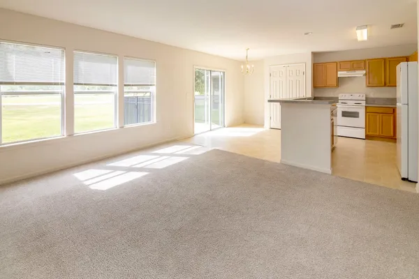 an aerial view of a house with swimming pool garden and patio