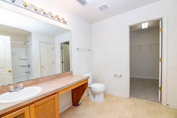 an aerial view of a house with garden space lake view and mountain view