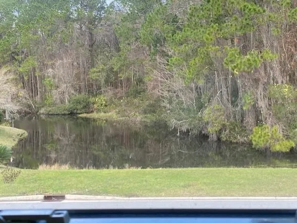 a view of a lake with a yard