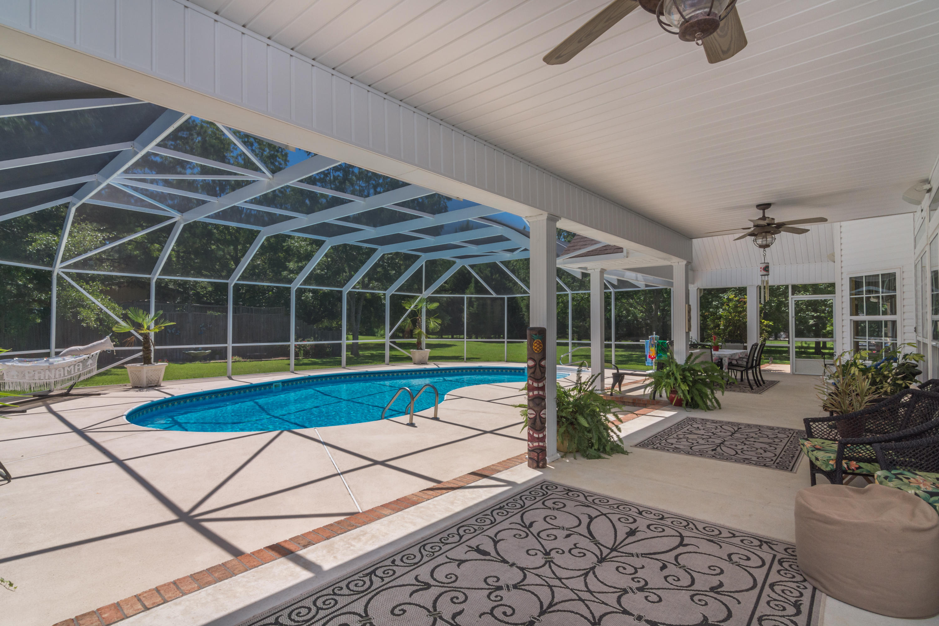 5985 Jack Stokes Road Baker, FL 32531 - Photo 41 of 63 a house with pool garden view