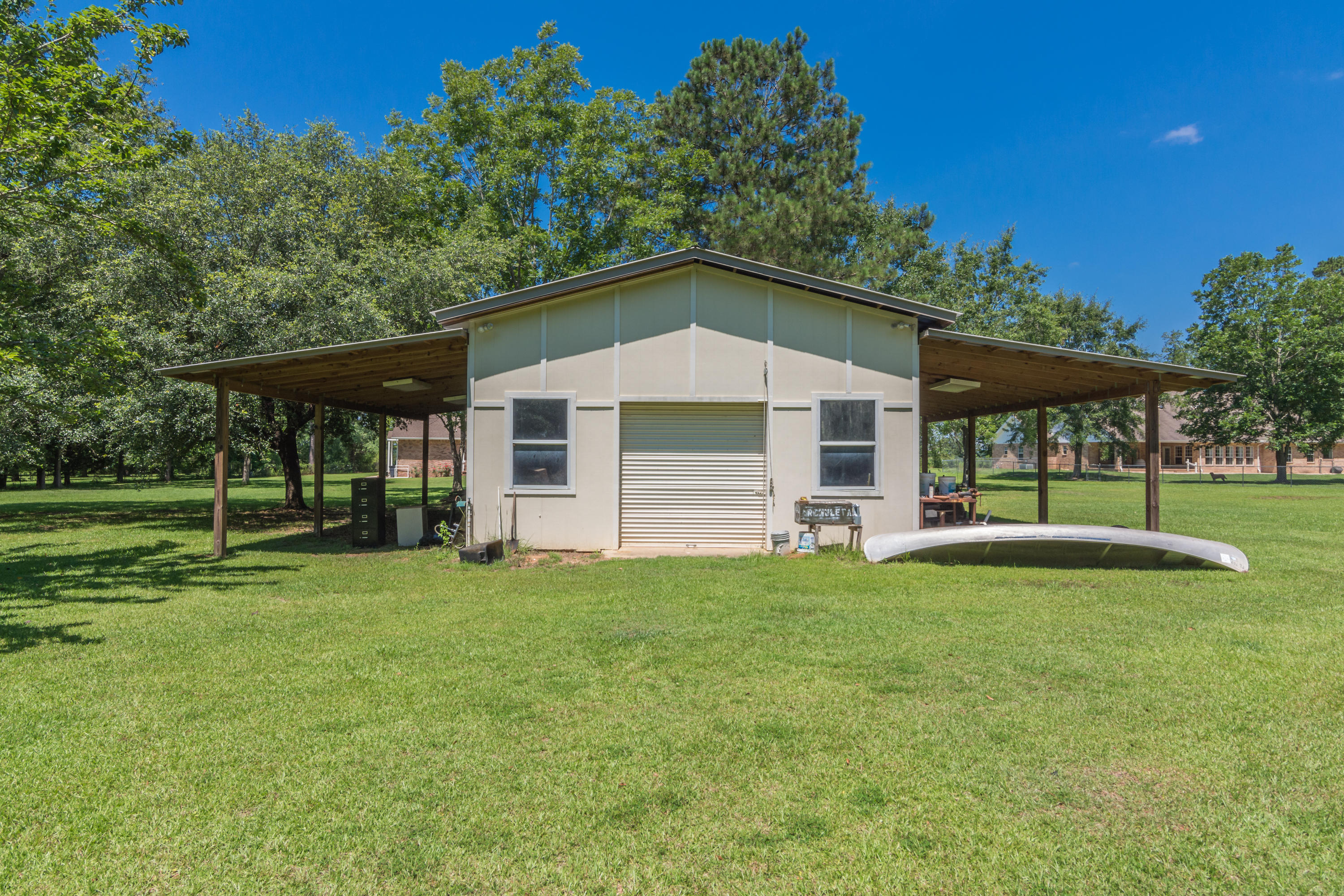 5985 Jack Stokes Road Baker, FL 32531 - Photo 54 of 63 a front view of a house with a yard