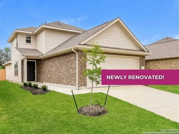 a sign that is sitting in front of a house