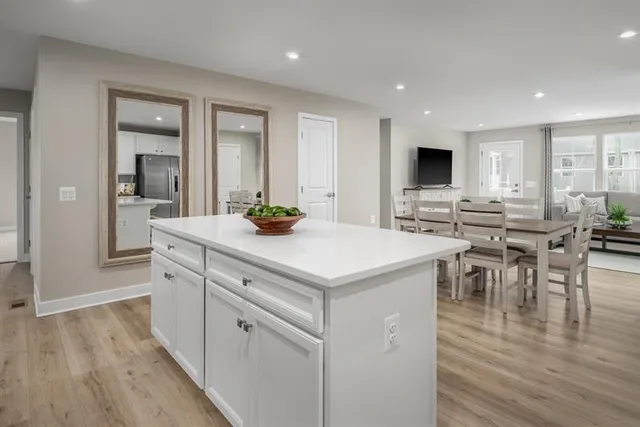 a kitchen with a sink a counter top space and stainless steel appliances