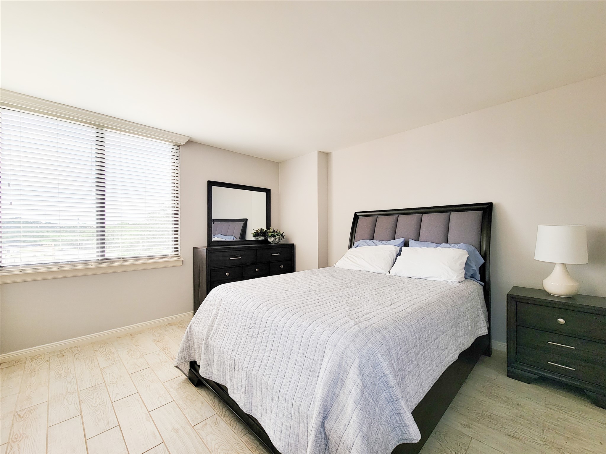 3525 Sage Road, Unit 303 Houston, TX 77056 - Photo 29 of 41 Ceramic tile flooring, more natural light and a view of the pool!