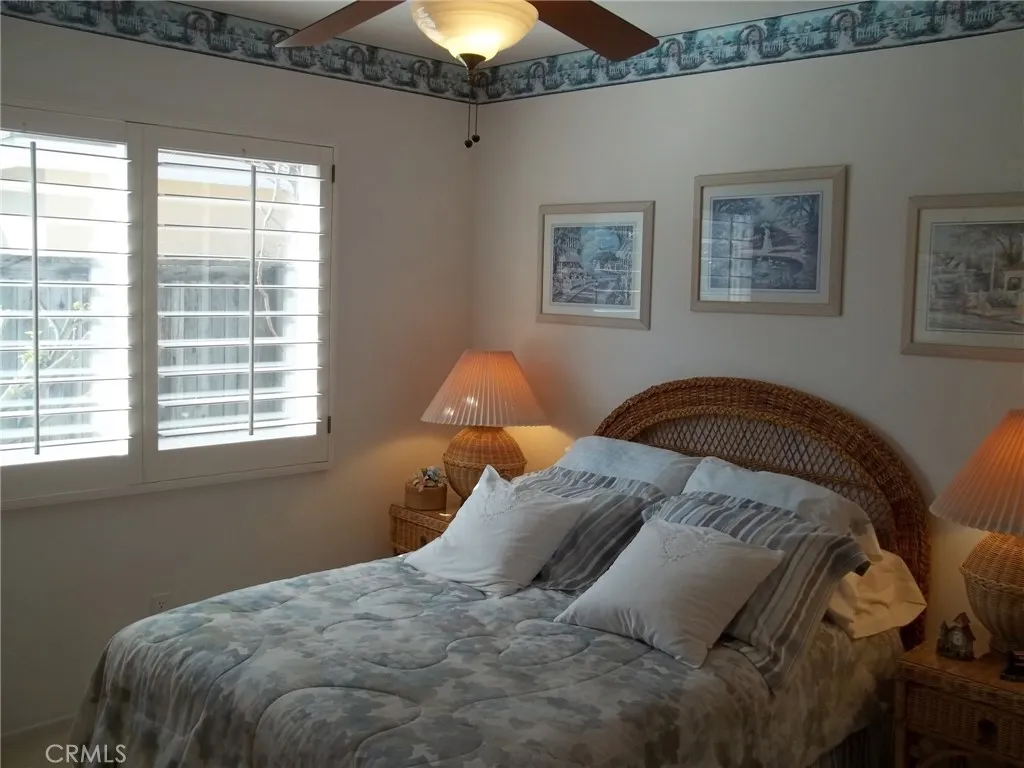 1647 Shire Avenue Oceanside, CA 92057 - Photo 12 of 15 a bedroom with a bed and a window