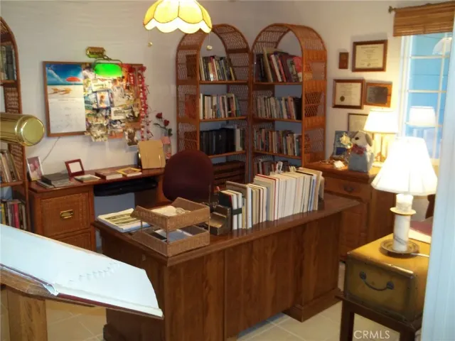 a table chair sitting in a kitchen next to a window