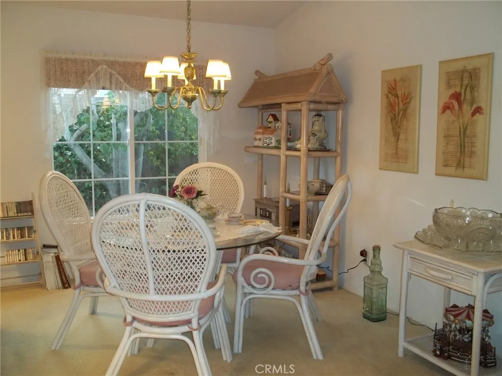 1647 Shire Avenue Oceanside, CA 92057 - Photo 5 of 15 a view of a dining room with furniture wooden floor and chandelier