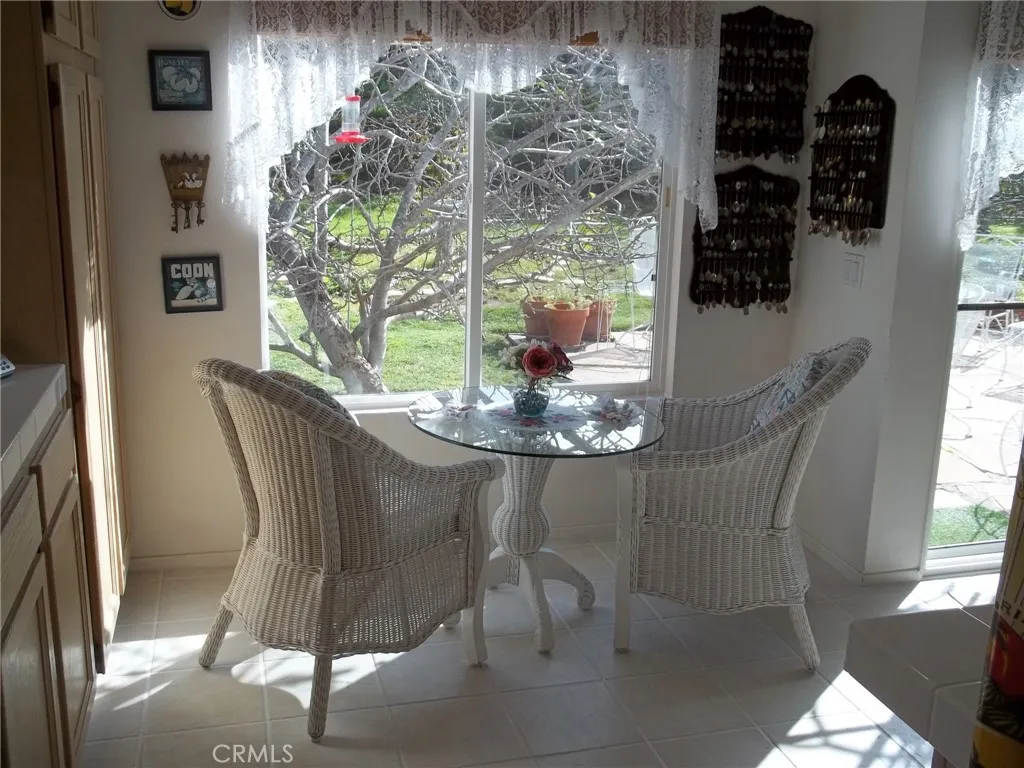 1647 Shire Avenue Oceanside, CA 92057 - Photo 9 of 15 a dining room with furniture and potted plants
