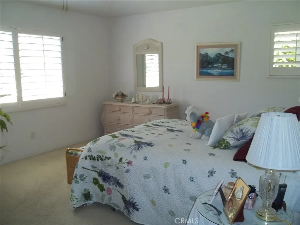 1647 Shire Avenue Oceanside, CA 92057 - Photo 10 of 15 a bedroom with a bed and a lamp on dresser
