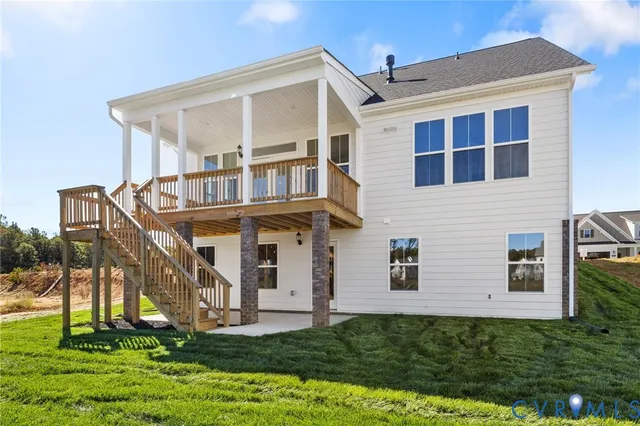 a view of a balcony with floor to ceiling window wooden floor and fence