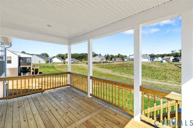a view of a balcony with yard