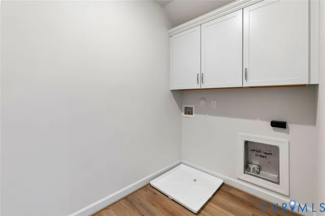 a view of an empty room and wooden floor