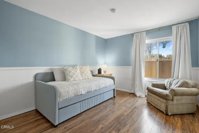 a bed room with a bed and a couch