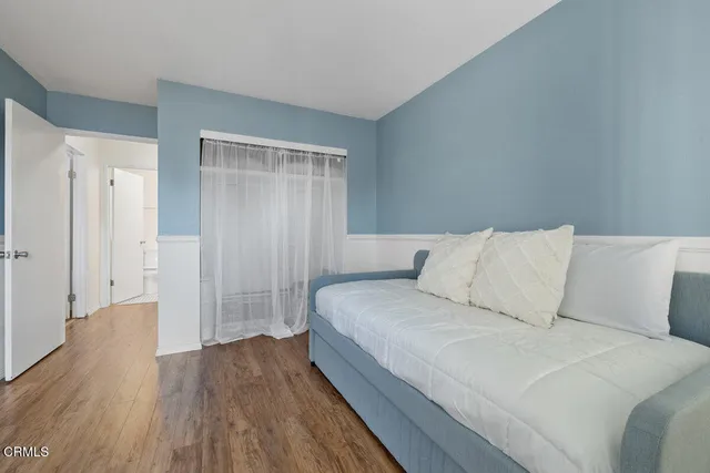 a room with a bed and a night stand