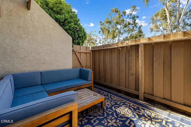 a view of sitting area with wooden walls