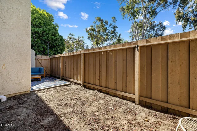 a view of a backyard of the house