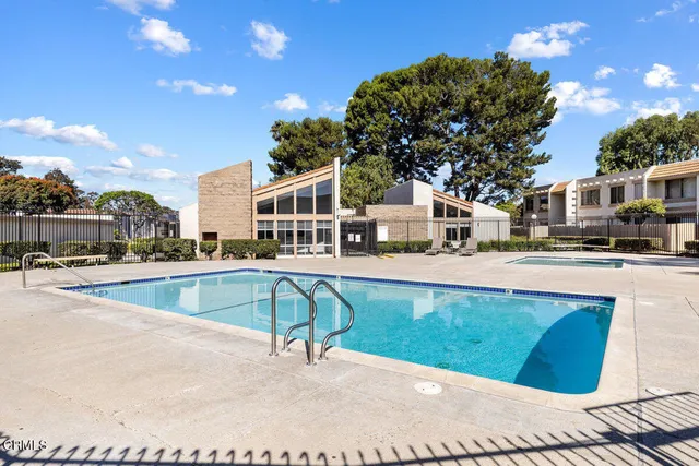 a view of a swimming pool with a patio