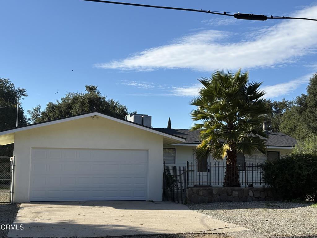 a house with a tree in front of it