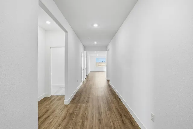 a view of a room with shelf on the wall