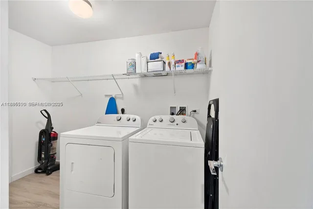 a utility room with dryer and washer
