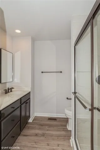 a bathroom with double sink and a mirror