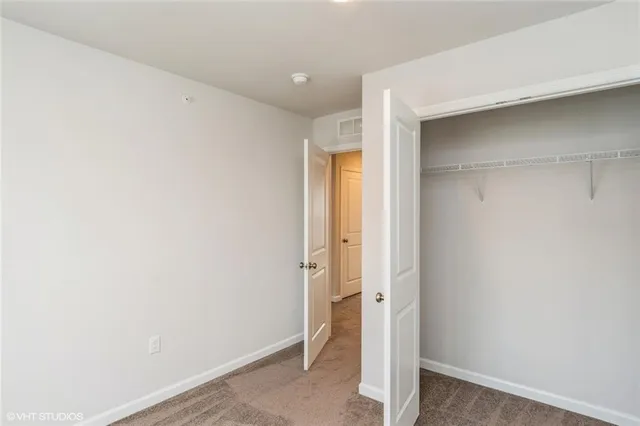 a bathroom with a sink toilet a mirror and shower