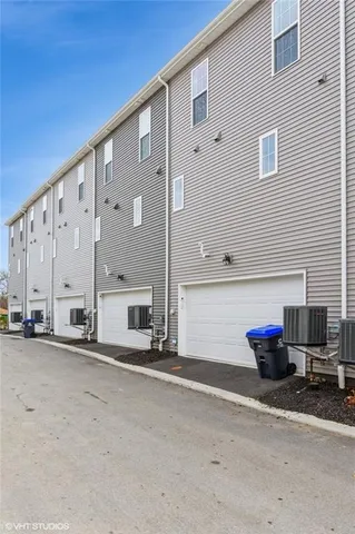 a front view of a house with parking space